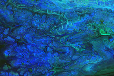 Abstract background of acrylic paint in blue and aquamarine tones