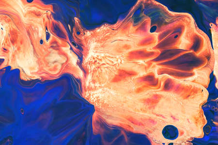 Abstract background of acrylic paint in orange and blue tones