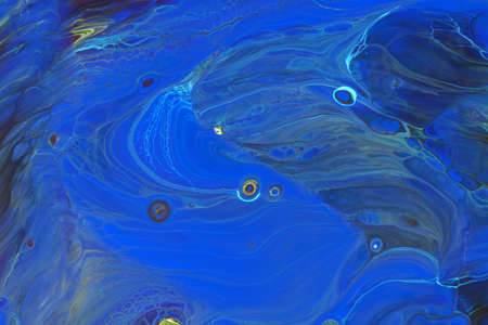 Abstract background of acrylic paint in blue tones