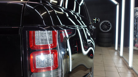 Clean shiny car at the car wash in detailingの写真素材