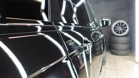 Clean shiny car at the car wash in detailingの写真素材