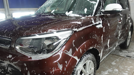 Clean shiny car at the car wash in detailingの写真素材