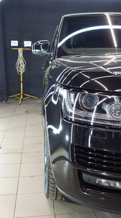 Clean shiny car at the car wash in detailingの写真素材