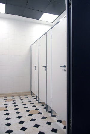 White doors with handles to the toiletのeditorial素材