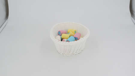 White vase with colored marshmallowsの写真素材