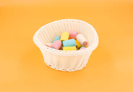 White vase with colored marshmallowsの写真素材