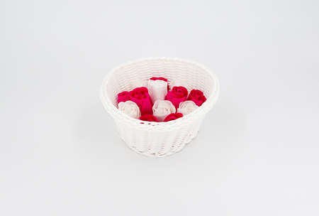 White wicker vase with rosesの写真素材