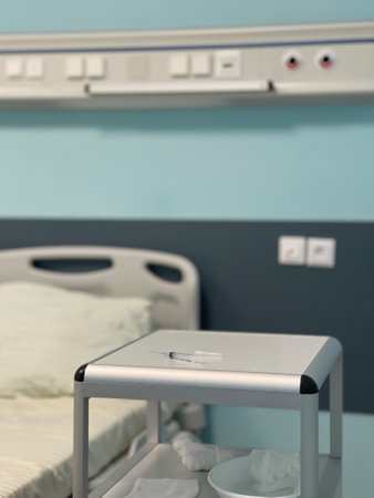 The syringe is on the bedside table in the hospital roomの写真素材