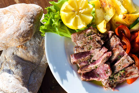 Delicious western meal with break and beef on tableの写真素材