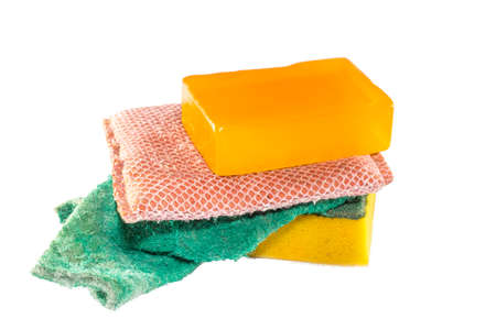 Old dirty dish washing sponges and soap on white backgroundの写真素材