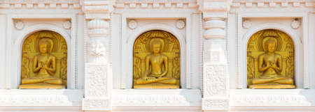 Three buddha statue sit on white Patternの写真素材