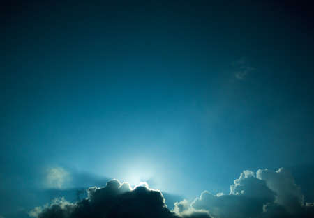 Sunset under cloudsの写真素材