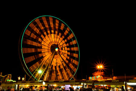 Wheel at a carnival at nightの写真素材