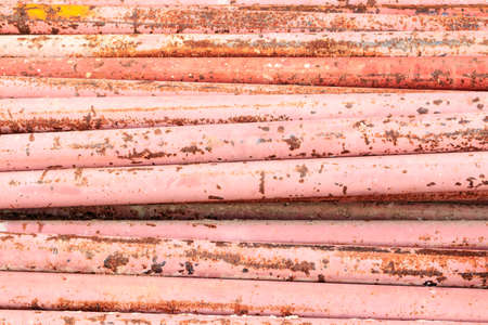 parallel rusty iron pipes Backgroundの写真素材