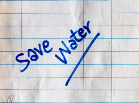 white Notebook Paper with red line, Save water wordの写真素材