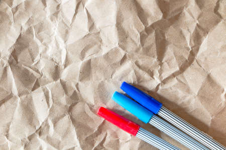 Paper texture - brown paper sheet with color pensの写真素材