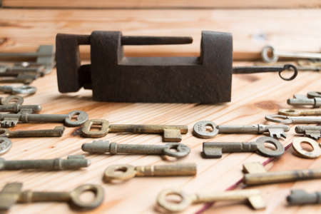 Old key on a wooden background