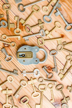 Old key on a wooden backgroundの写真素材