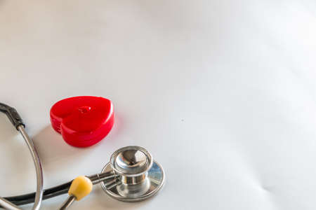 Stethoscope with tools on white backgroundの写真素材