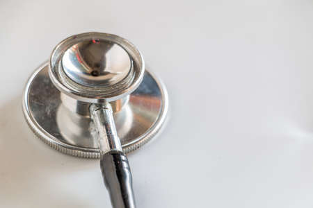 Stethoscope with tools on white backgroundの写真素材