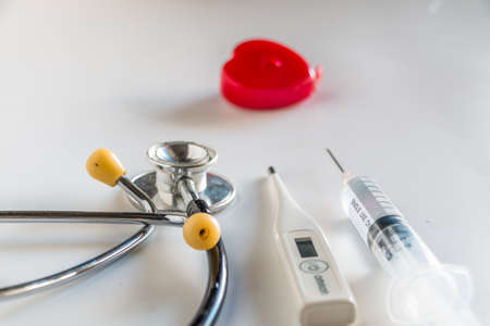 Stethoscope with tools on white backgroundの写真素材