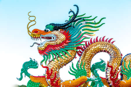 Exotic gold dragon on blue sky background.の写真素材