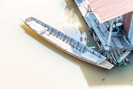 Water House people who live the river in thailand with wooden boat and water plant.の写真素材