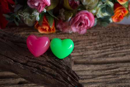 Rose with package on wooden, in love mood.の写真素材