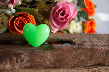 Rose with package on wooden, in love mood.の写真素材