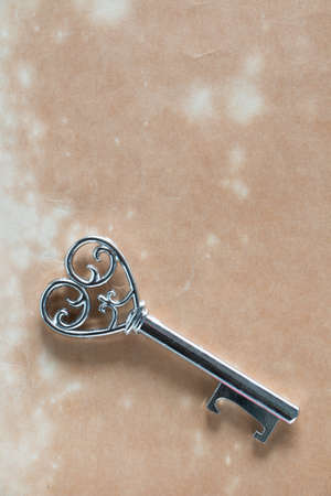Love key on old paper, in love mood.の写真素材