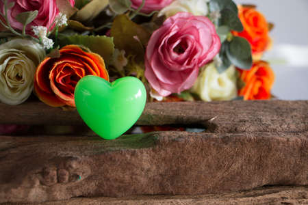 Rose with package on wooden, in love mood.の写真素材