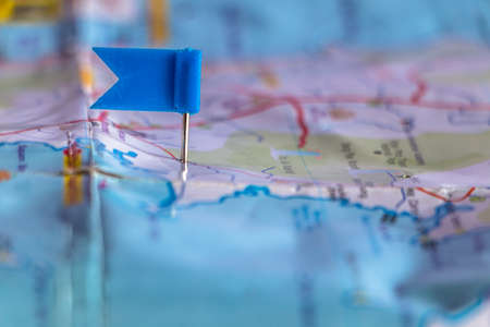 Travel destination pin points on a map with colorful thumbtacks and depth of field with select focus.の写真素材
