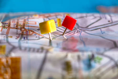 Travel destination pin points on a map with colorful thumbtacks and depth of field with select focus.の写真素材