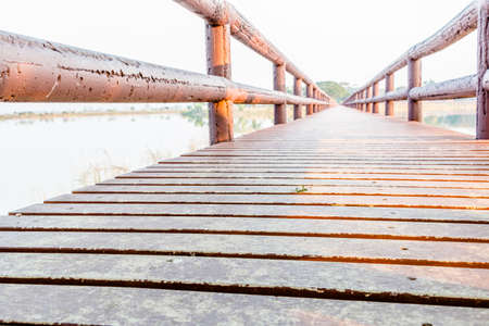 Wooden boardwalk in the beach vanishing point perspective.の写真素材