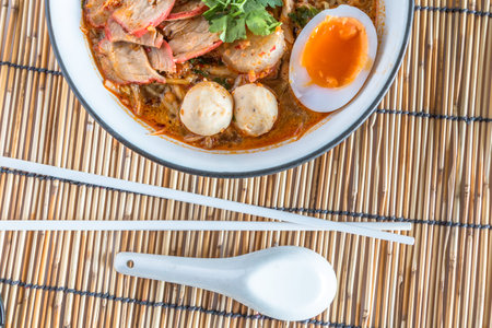 Delicious noodles with shrimp close-up on a plate, choose form top view.