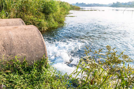 Unclean water from the sewer flows into the river.の写真素材