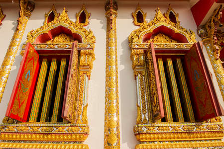 Thai art windows in temple of thailandの写真素材