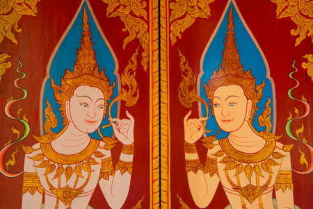 traditional Thai style art painting on door  in temple ,Thailandの写真素材