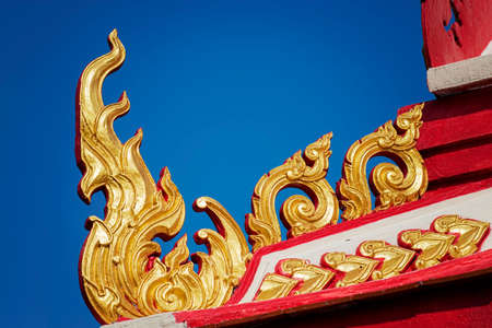 thai temple roof with blue sky ,Thailandの写真素材