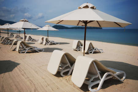 Chairs beach and umbrella at Phuket ,Thailandの写真素材