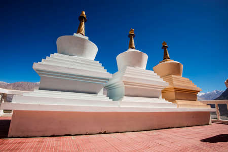 Three stupa and blue sky at Diskit monastery, Ladakh, India - September 2014の写真素材