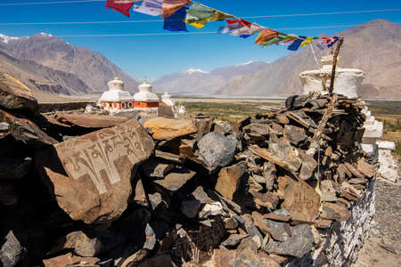 Stupa and player flags near Diskit monastery in Ladakh, Jammu & Kashmir, India - September 2014の写真素材