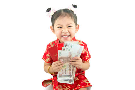 Happy Chinese new year .Cute Asian Girl In Tradition Chinese and Her Lucky Envelope Isolated On White Background.の写真素材