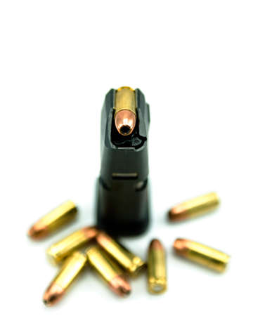 9mm bullets and magazine isolated on white background.