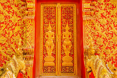 art door carving guardian giant in the temple ,Thailandの写真素材