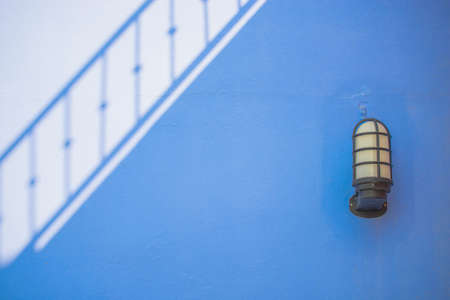 shadow on cement wall and lamp background.の写真素材