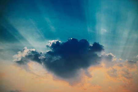 Dramatic nice sky sunset with sun rays.の写真素材
