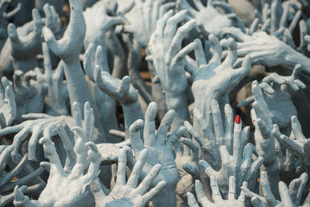 Ghost hands from hell, Conceptual sculpture decorations in Rongkhun Temple Chiangrai, Thailand.の写真素材