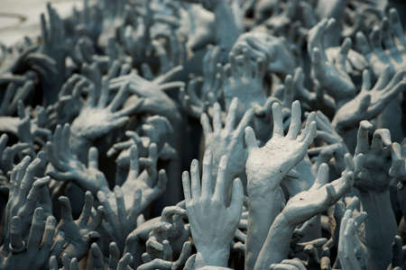 Ghost hands from hell, Conceptual sculpture decorations in Rongkhun Temple Chiangrai, Thailand.の写真素材