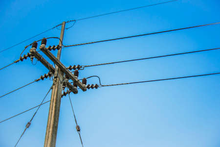 electric post and blue skyの写真素材